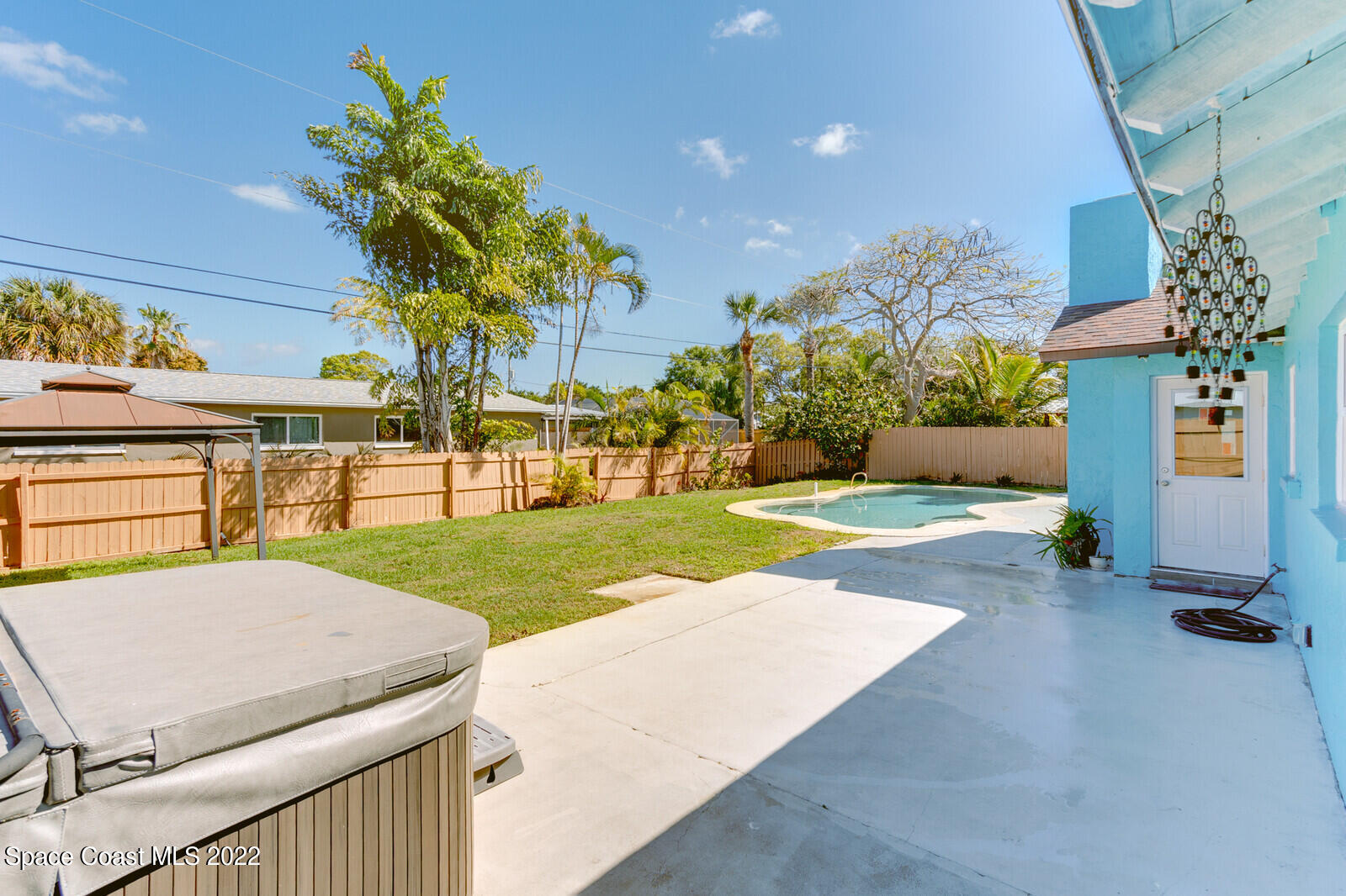 210 Sand Pine Road Indialantic, FL 32903 - Photo 26 of 45 a view of a backyard with a garden and plants