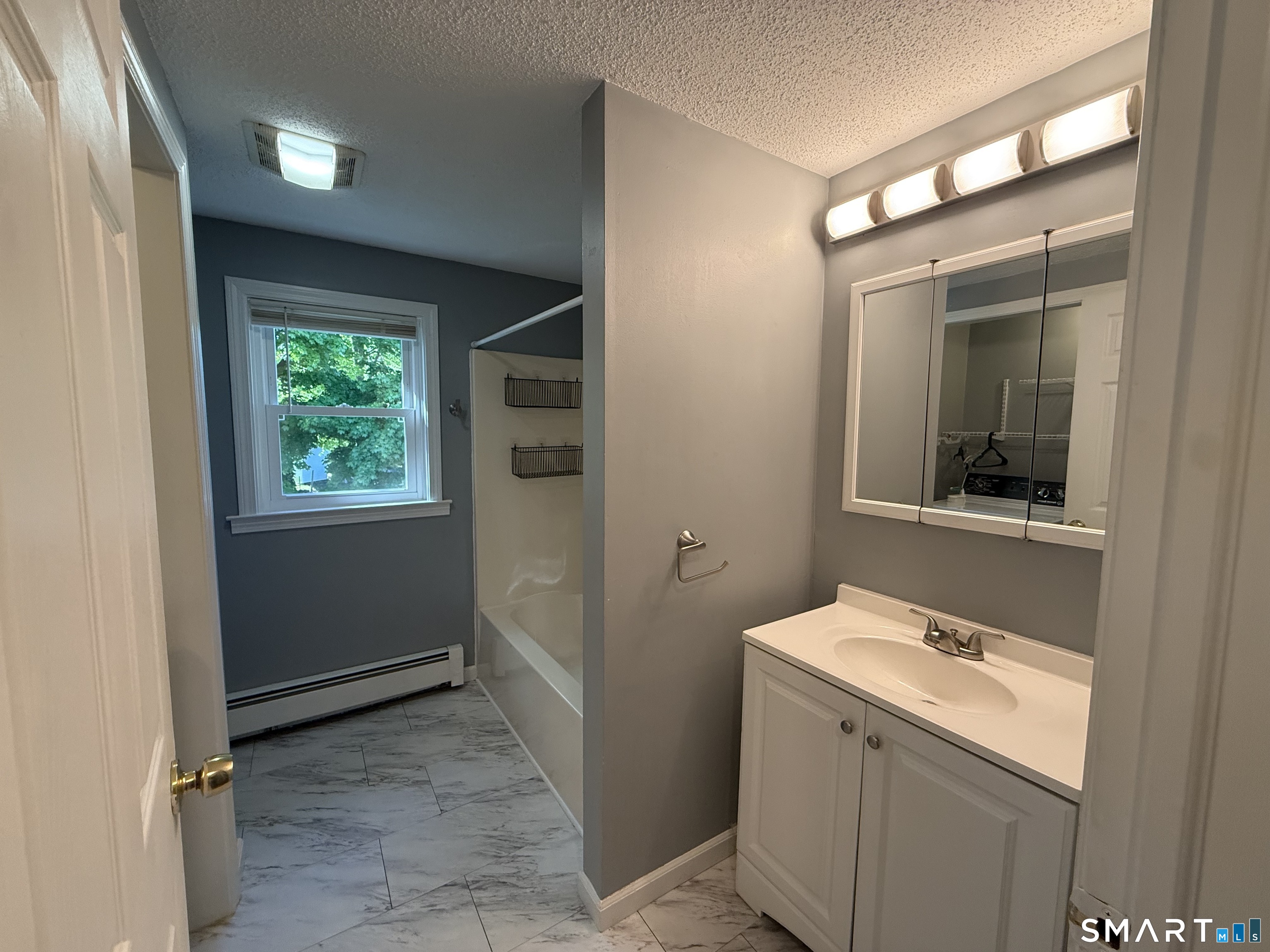 808 East Main Street Torrington, CT 06790 - Photo 29 of 40 a bathroom with a sink and a mirror
