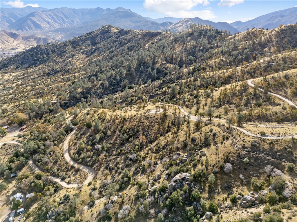 0 No Address Caliente, CA 93518 - Photo 16 of 17 a view of a city with lush green forest