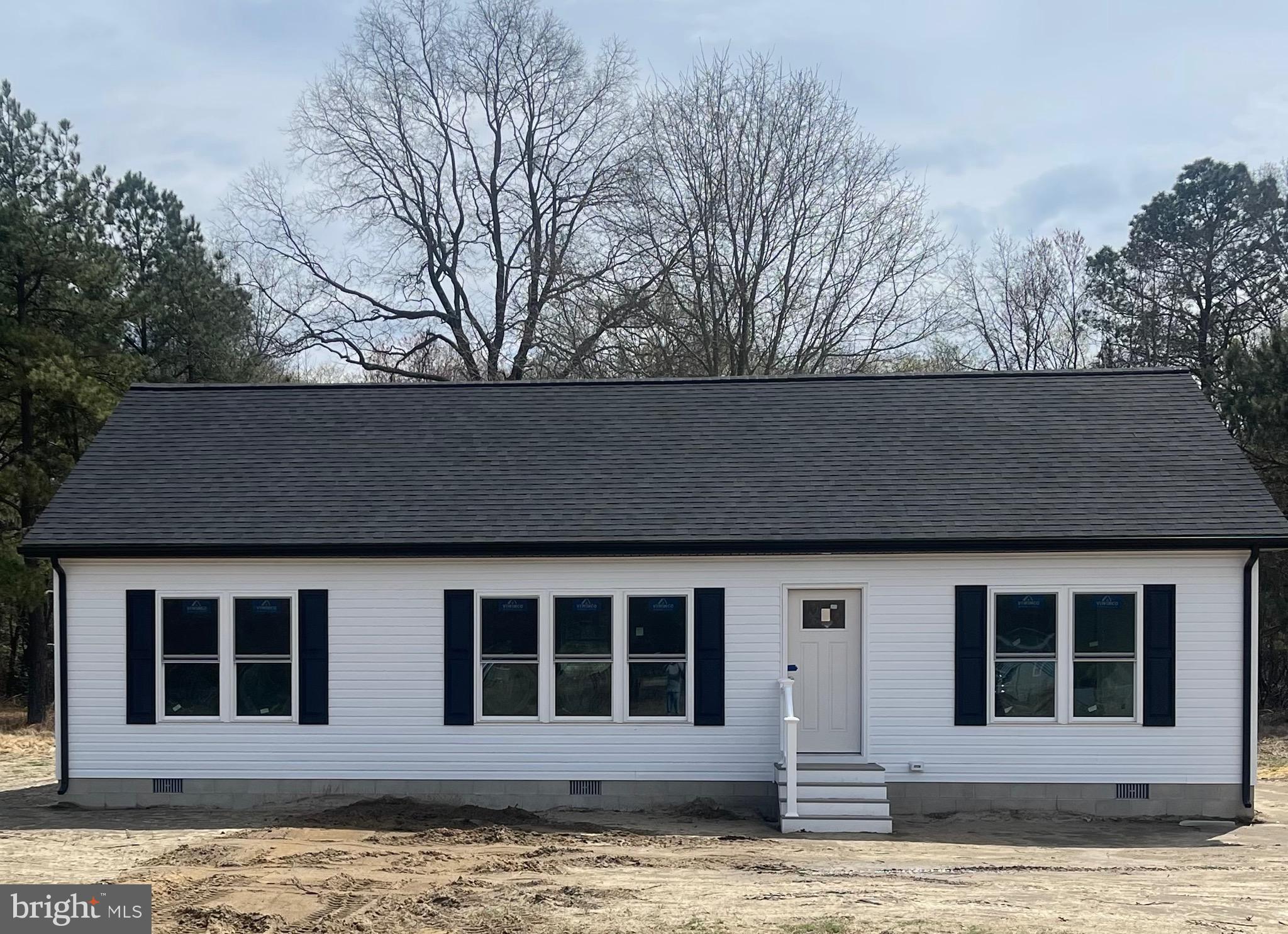 3390 Jefferson Pond Road Federalsburg, MD 21632 - Photo 1 of 5 a house view with a garden space