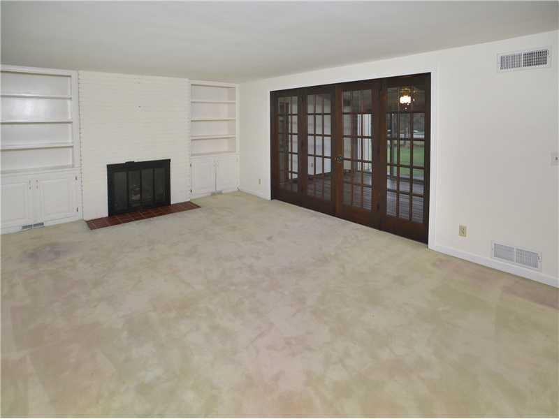 306 Murrysville Road Level Green, PA 15085 - Photo 9 of 21 Living Room. Formal Dining Room with Gas Fireplace. Double French doors overlooking family room. Hardwood floors under carpeting.