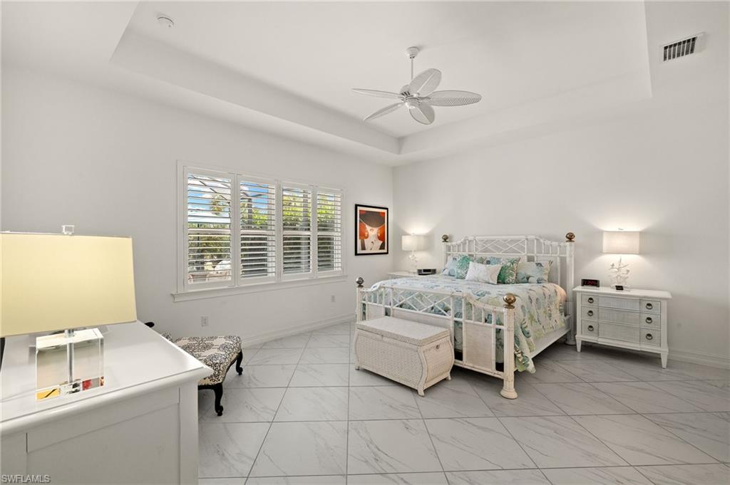 14809 Windward Lane Naples, FL 34114 - Photo 20 of 50 a bed room with bed and window