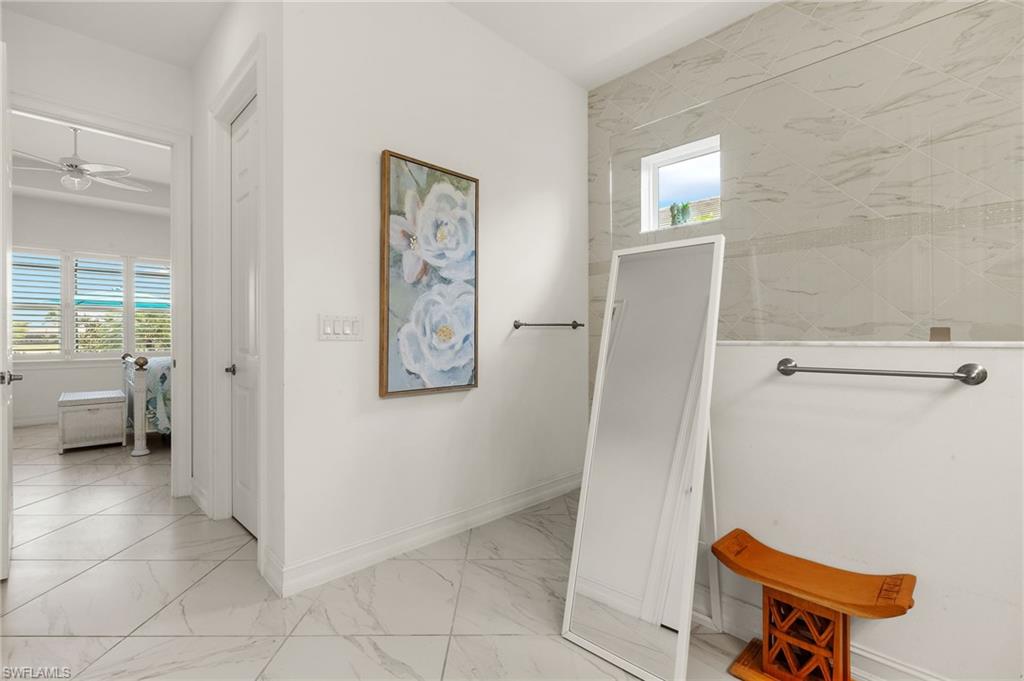 14809 Windward Lane Naples, FL 34114 - Photo 25 of 50 a view of a hallway with closet and a living room