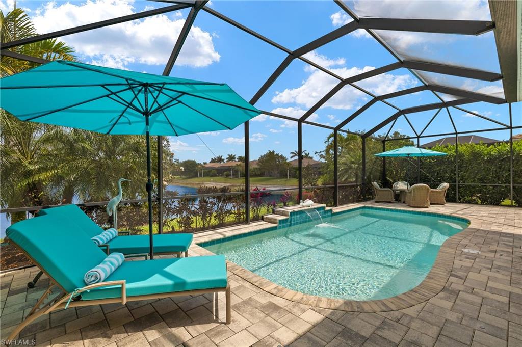 14809 Windward Lane Naples, FL 34114 - Photo 38 of 50 a view of a backyard with a sitting area