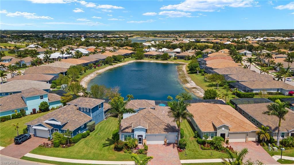 14809 Windward Lane Naples, FL 34114 - Photo 40 of 50 an aerial view of residential houses with outdoor space