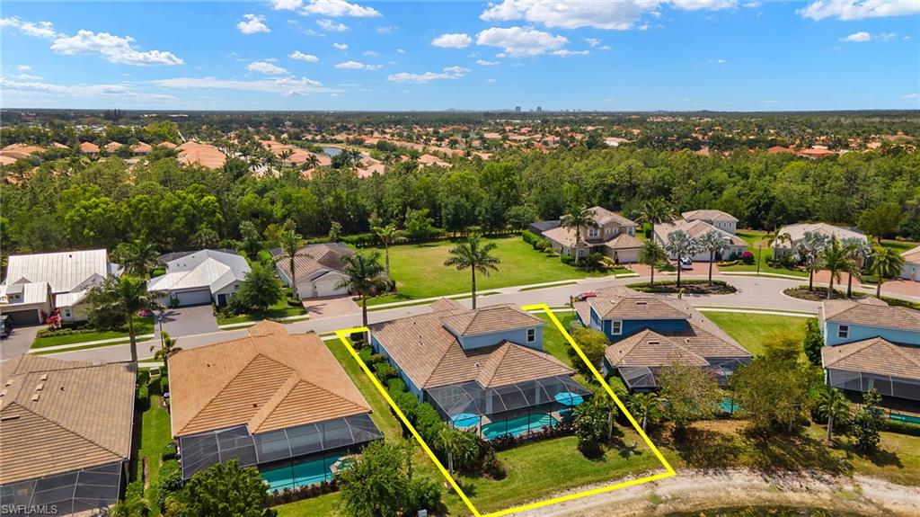 14809 Windward Lane Naples, FL 34114 - Photo 48 of 50 a view of a swimming pool and lounge chairs