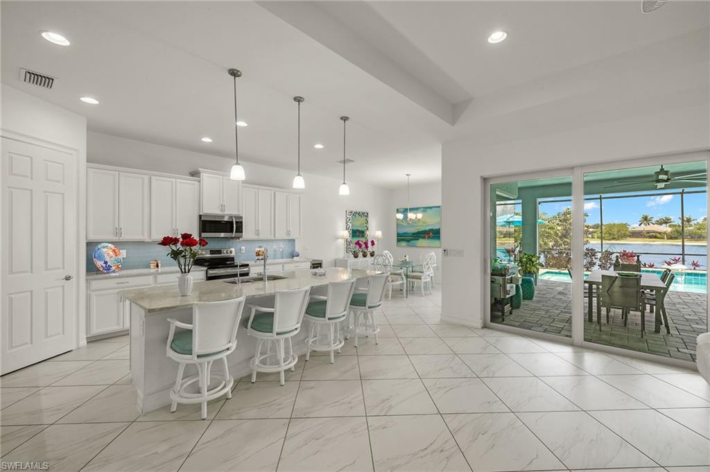 14809 Windward Lane Naples, FL 34114 - Photo 7 of 50 a view of a dining area with furniture