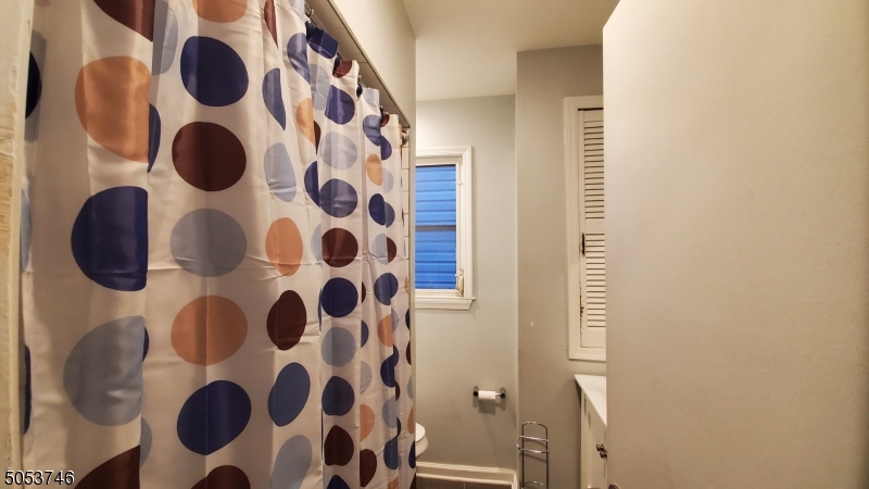 34 Olive Street, Unit 2 Bloomfield, NJ 07003 - Photo 14 of 19 a bathroom with a bathtub and a shower