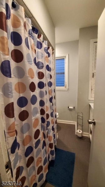 34 Olive Street, Unit 2 Bloomfield, NJ 07003 - Photo 15 of 19 a bathroom with a bathtub and a shower