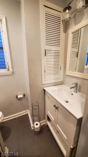 34 Olive Street, Unit 2 Bloomfield, NJ 07003 - Photo 16 of 19 a bathroom with a sink a mirror and a bathtub