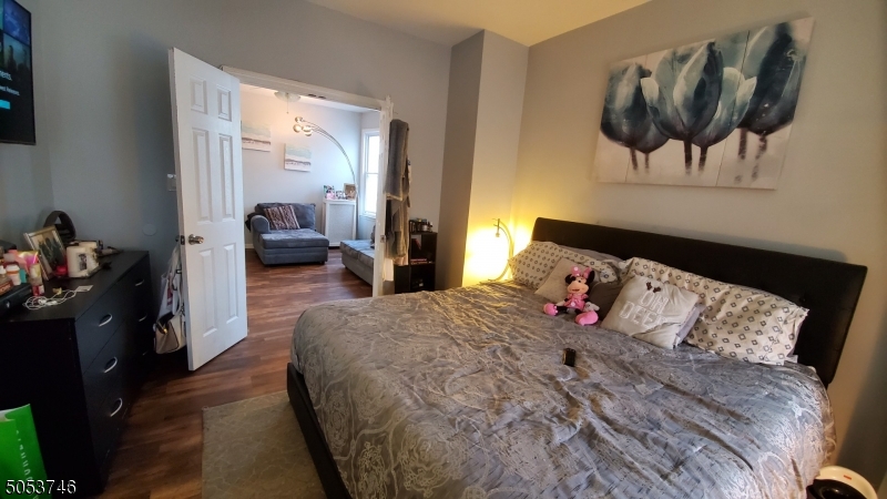 34 Olive Street, Unit 2 Bloomfield, NJ 07003 - Photo 5 of 19 a bed room with a bed and a couch