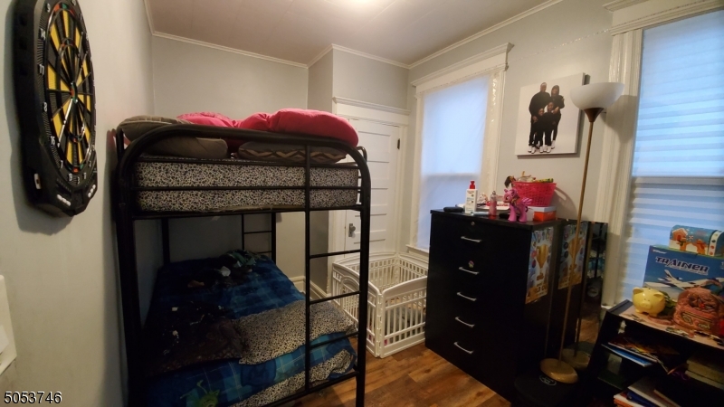 34 Olive Street, Unit 2 Bloomfield, NJ 07003 - Photo 8 of 19 a bedroom with a bed and a closet