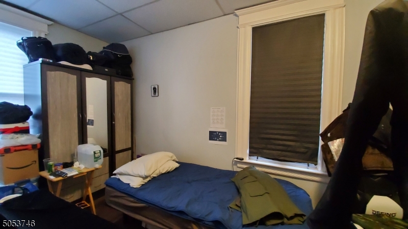 34 Olive Street, Unit 2 Bloomfield, NJ 07003 - Photo 9 of 19 a bedroom with a bed and a window