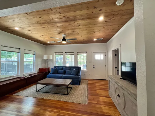a lobby with furniture and flat screen tv