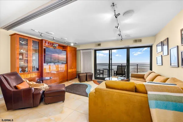a living room with furniture and a large window