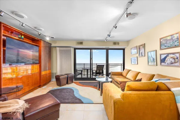 a living room with furniture and a large window