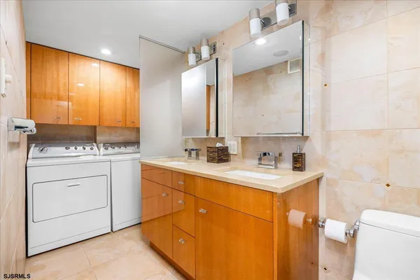 a bathroom with a sink double vanity and a mirror