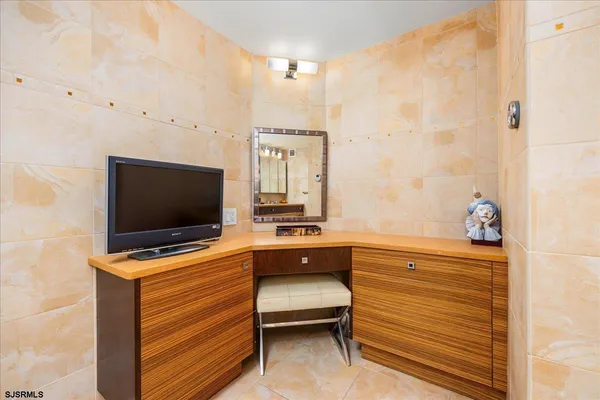 a room with furniture and flat screen tv