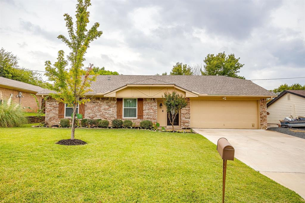 2217 Pecos Drive Grapevine, TX 76051 - Photo 1 of 1 a front view of a house with a yard