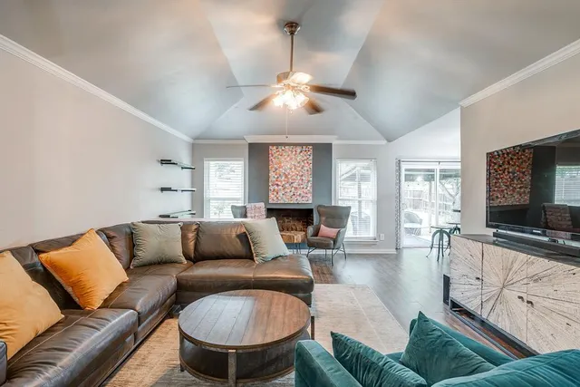 a living room with furniture and a flat screen tv