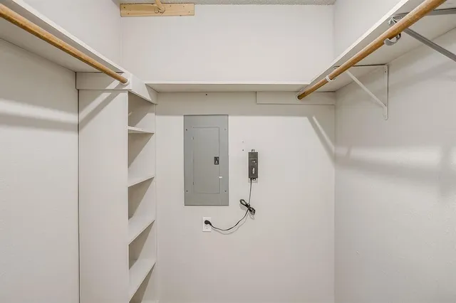 a bathroom with a shower and a glass door