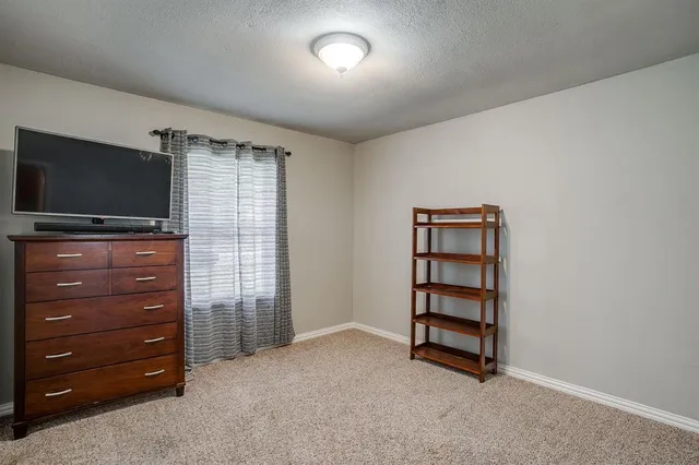 a room with furniture and flat screen tv