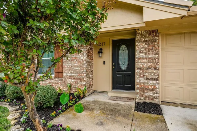 a front view of a house with a garage