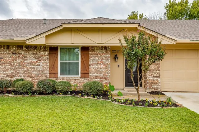 a aerial view of a house with a yard