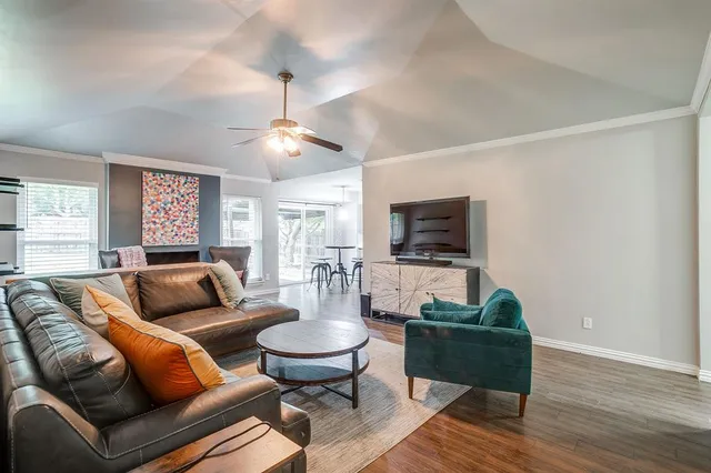 a living room with furniture and a flat screen tv