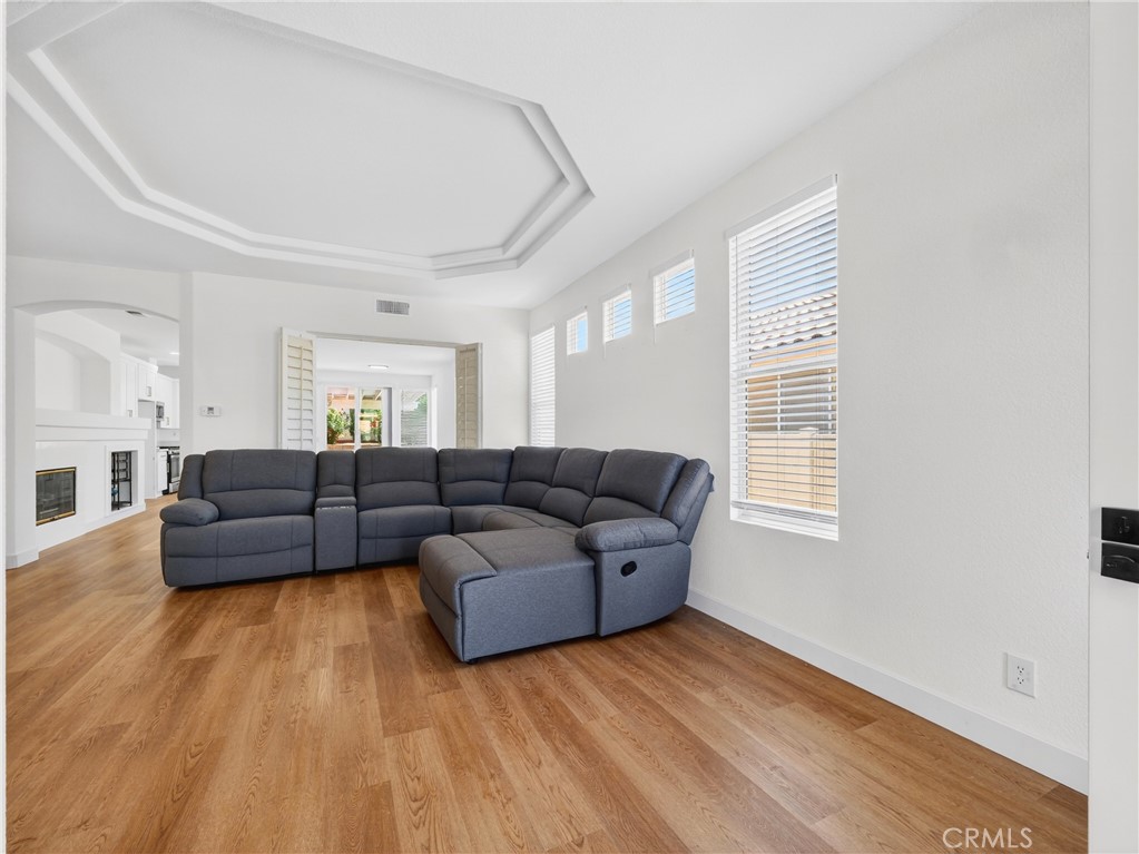 1436 Riviera Avenue Banning, CA 92220 - Photo 20 of 43 a living room with furniture and a hard wood floor