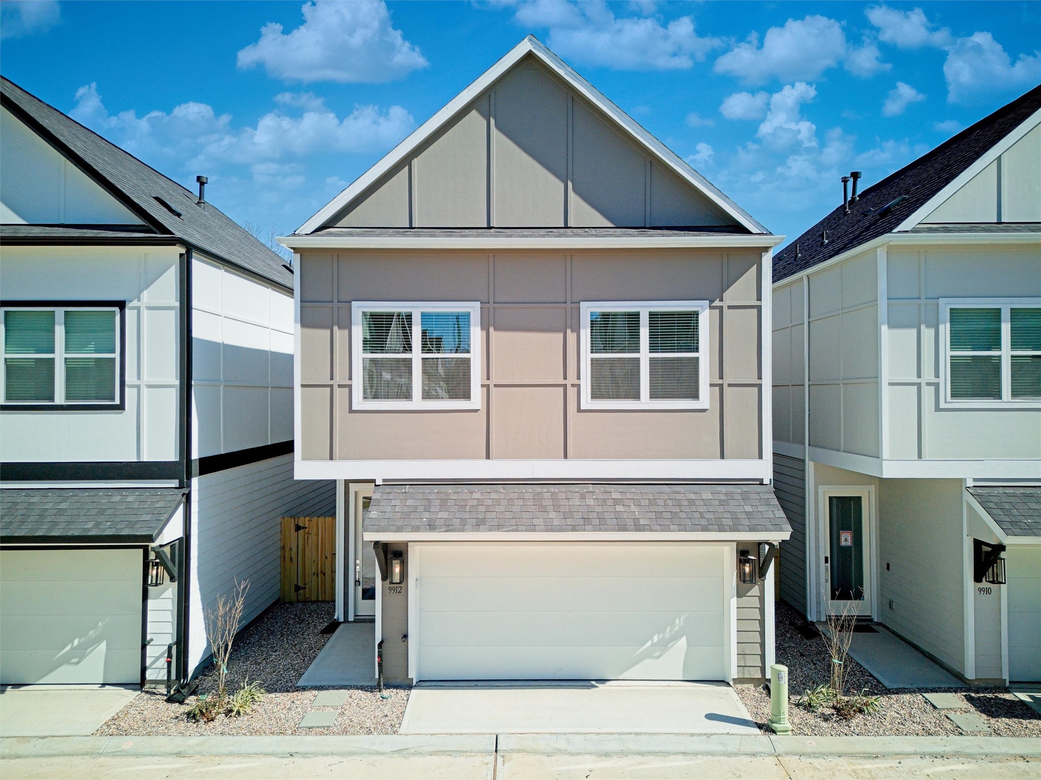 209 Clark Meadows Lane Houston, TX 77076 - Photo 1 of 50 a front view of a house with glass windows