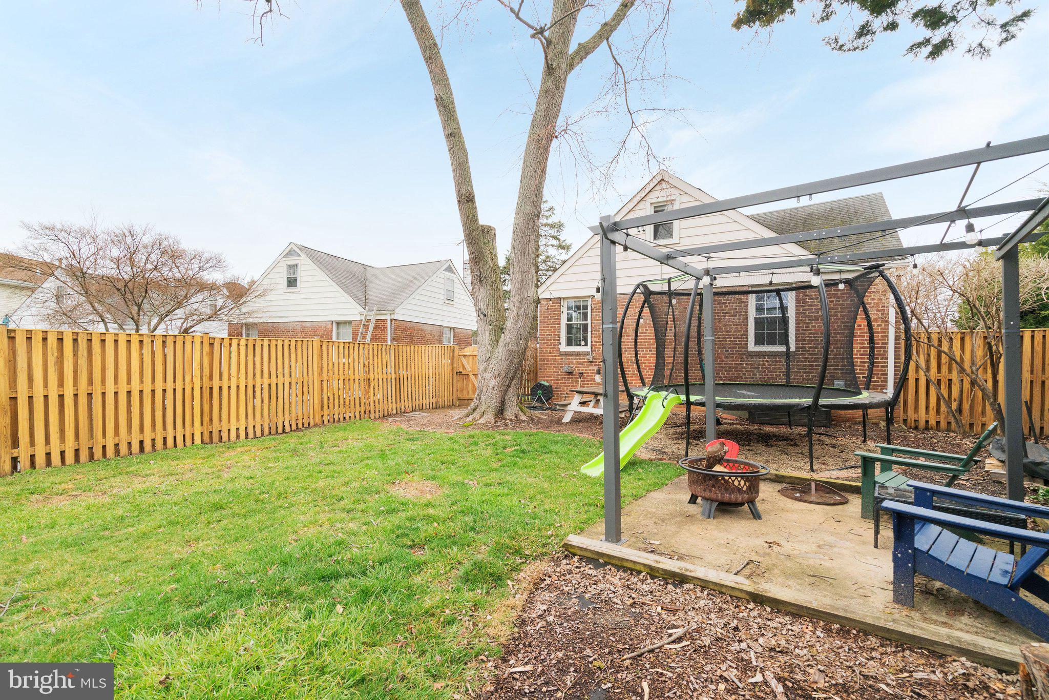 1901 Scroggins Road Alexandria, VA 22302 - Photo 37 of 38 Charming backyard retreat with swing set.