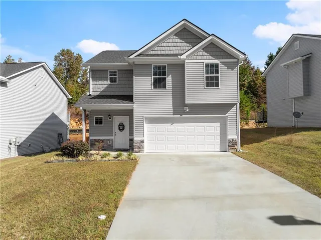 a front view of a house with a yard