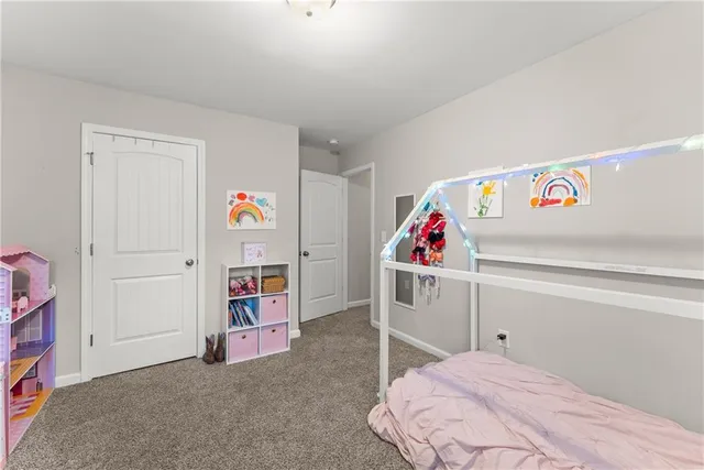 a utility room with toys and ceiling fan