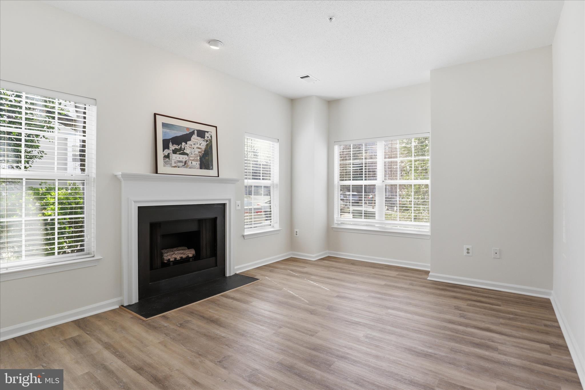 1704 Lake Shore Crest Drive, Unit 16 Reston, VA 20190 - Photo 4 of 39 Sunny Living rm w GAS FIREPLACE