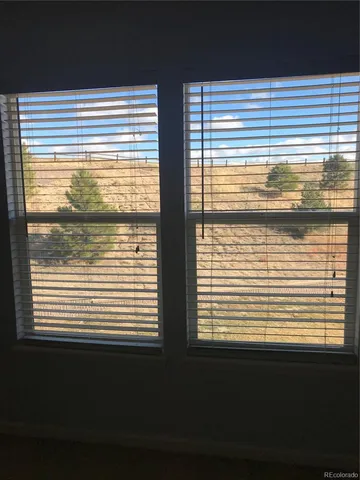 a view of a room with a large window