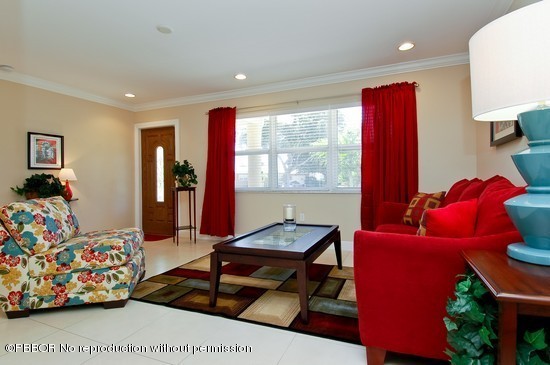 121 Gregory Road West Palm Beach, FL 33405 - Photo 2 of 8 a room with furniture and a window