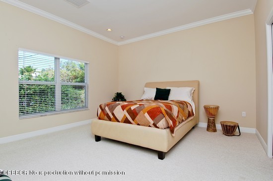 121 Gregory Road West Palm Beach, FL 33405 - Photo 6 of 8 a bedroom with a bed and a large window