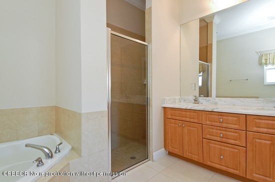 121 Gregory Road West Palm Beach, FL 33405 - Photo 7 of 8 a bathroom with a bathtub and a sink