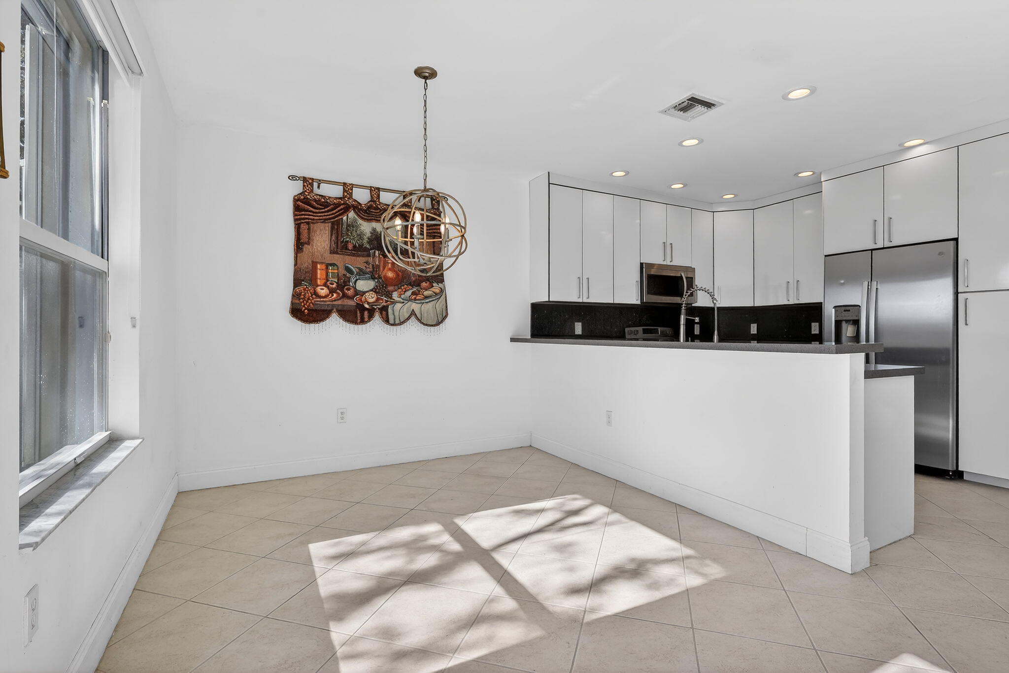 16286 Southwest 47th Manor Miramar, FL 33027 - Photo 15 of 61 a kitchen with stainless steel appliances a refrigerator sink and microwave