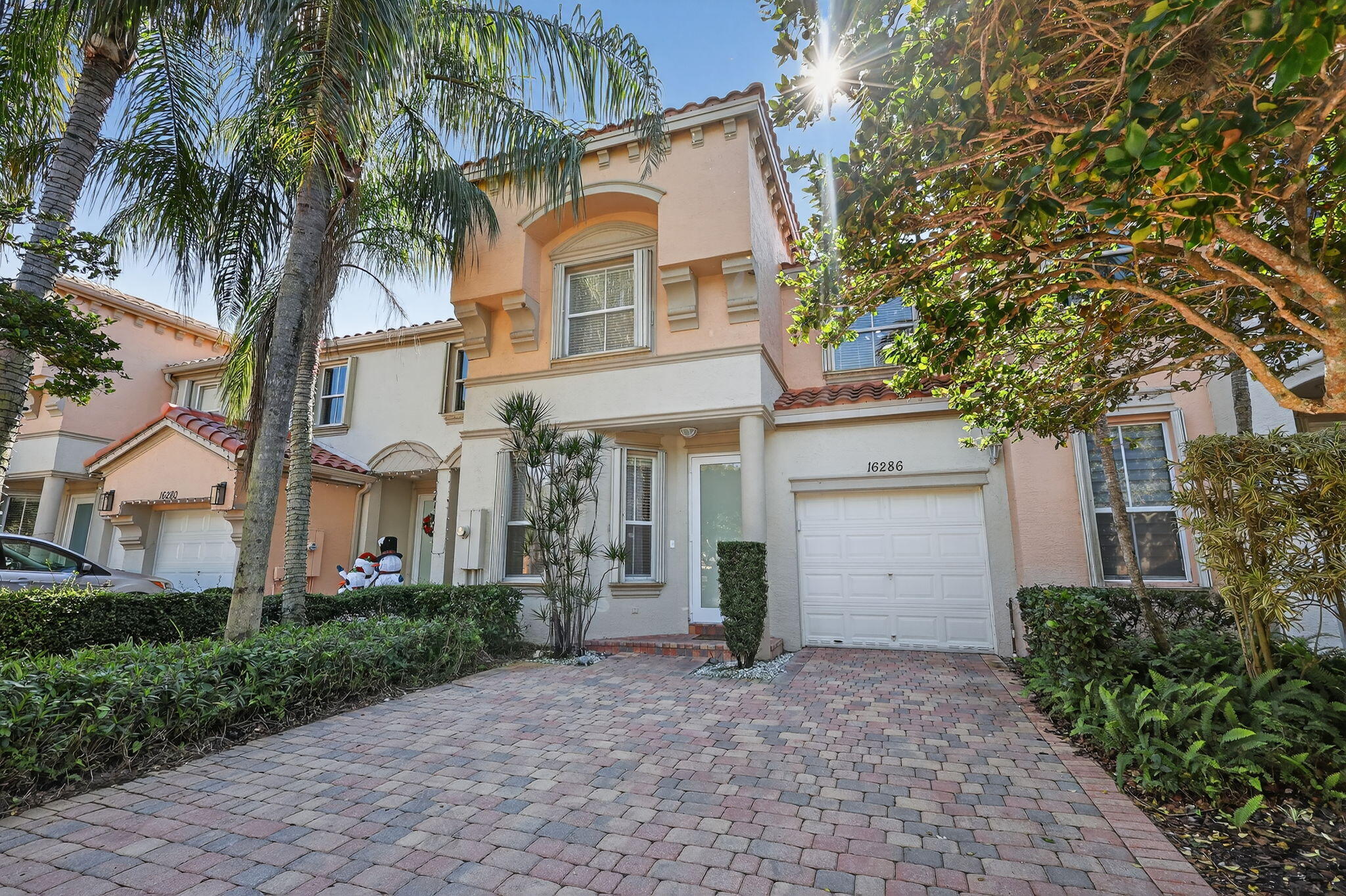 16286 Southwest 47th Manor Miramar, FL 33027 - Photo 2 of 61 a front view of a house with a yard and garage