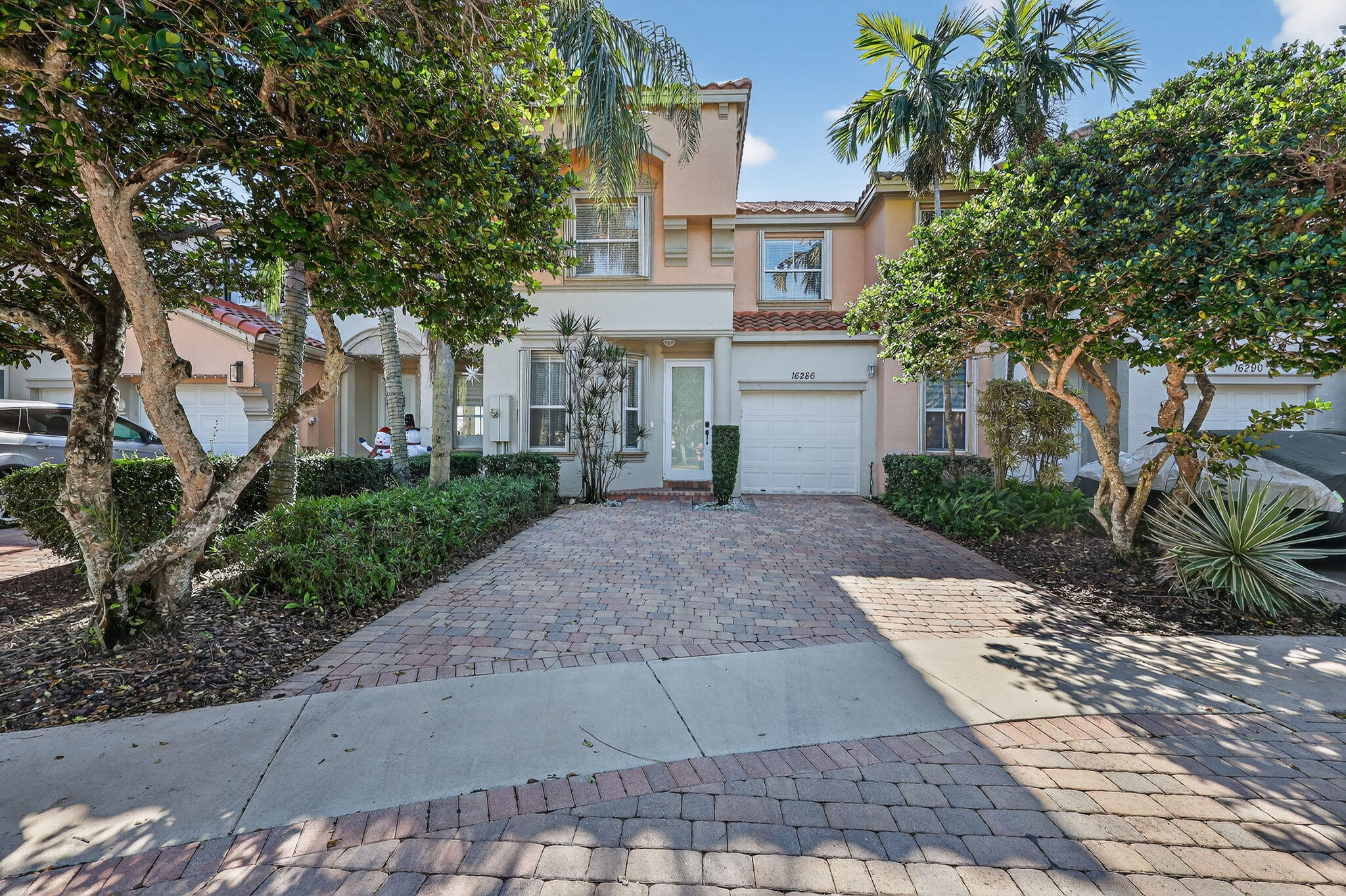 16286 Southwest 47th Manor Miramar, FL 33027 - Photo 3 of 61 a view of a white house with a yard