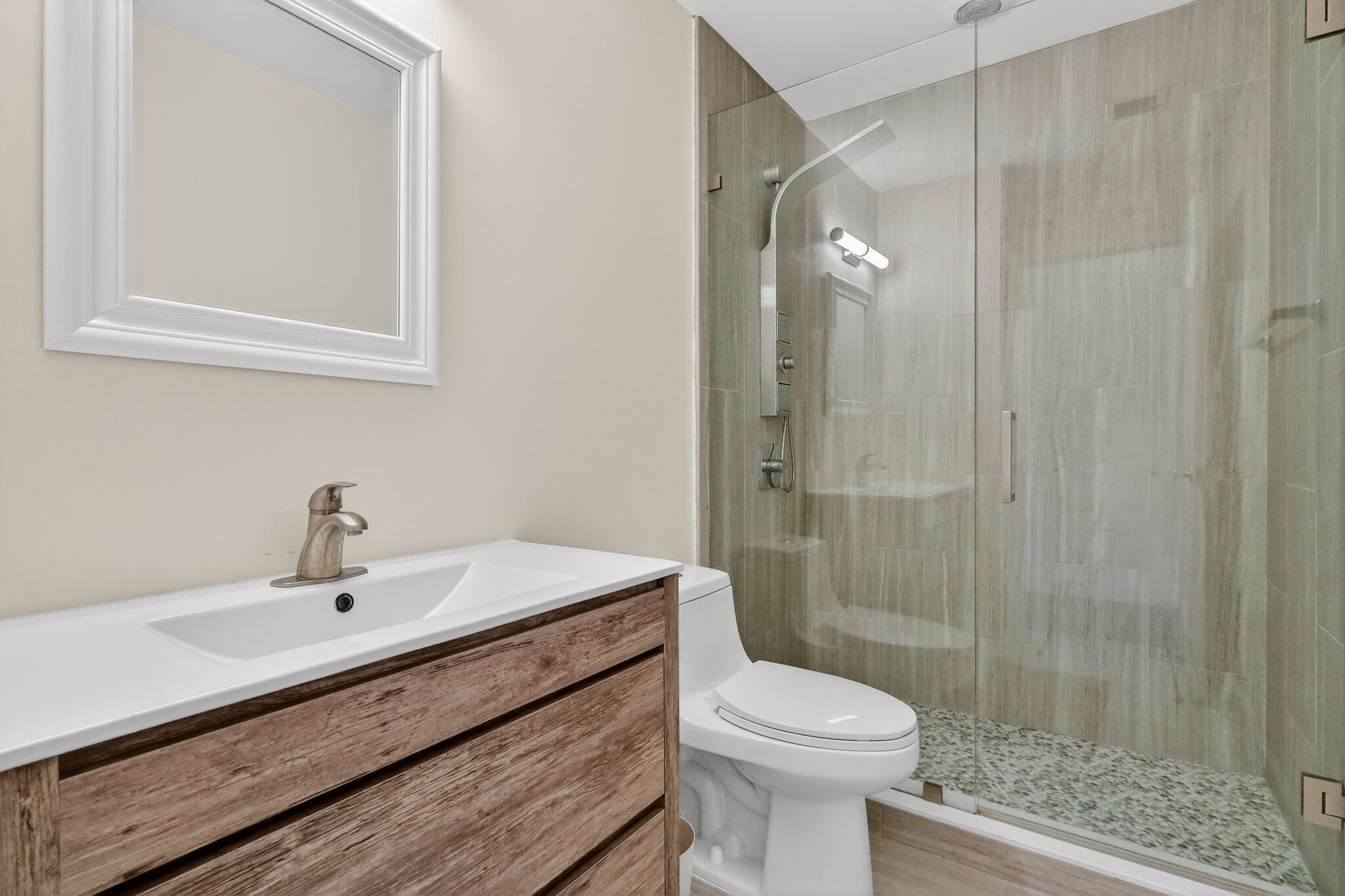 16286 Southwest 47th Manor Miramar, FL 33027 - Photo 35 of 61 a bathroom with a sink a toilet and shower