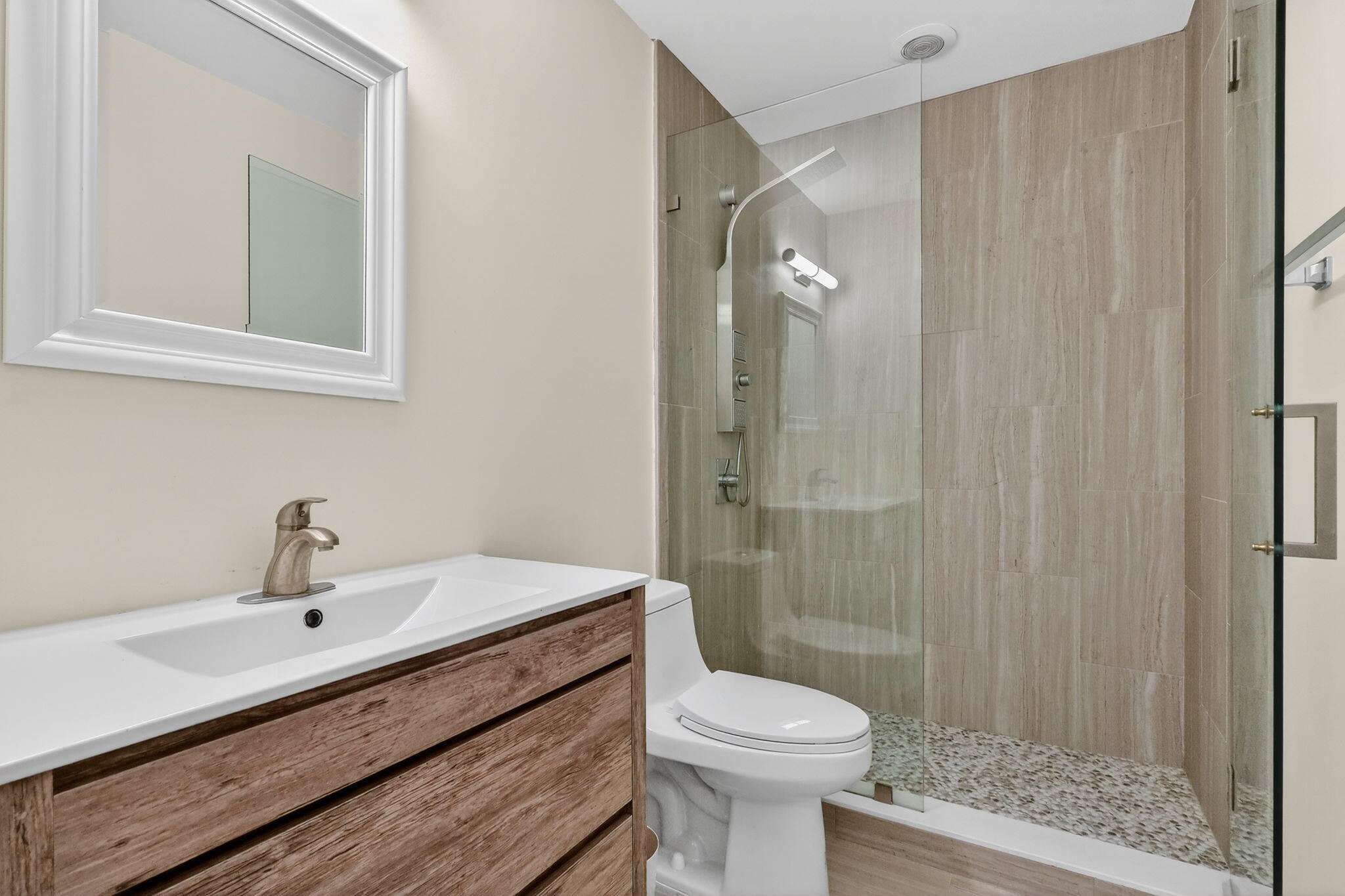 16286 Southwest 47th Manor Miramar, FL 33027 - Photo 38 of 61 a bathroom with a sink a toilet and shower