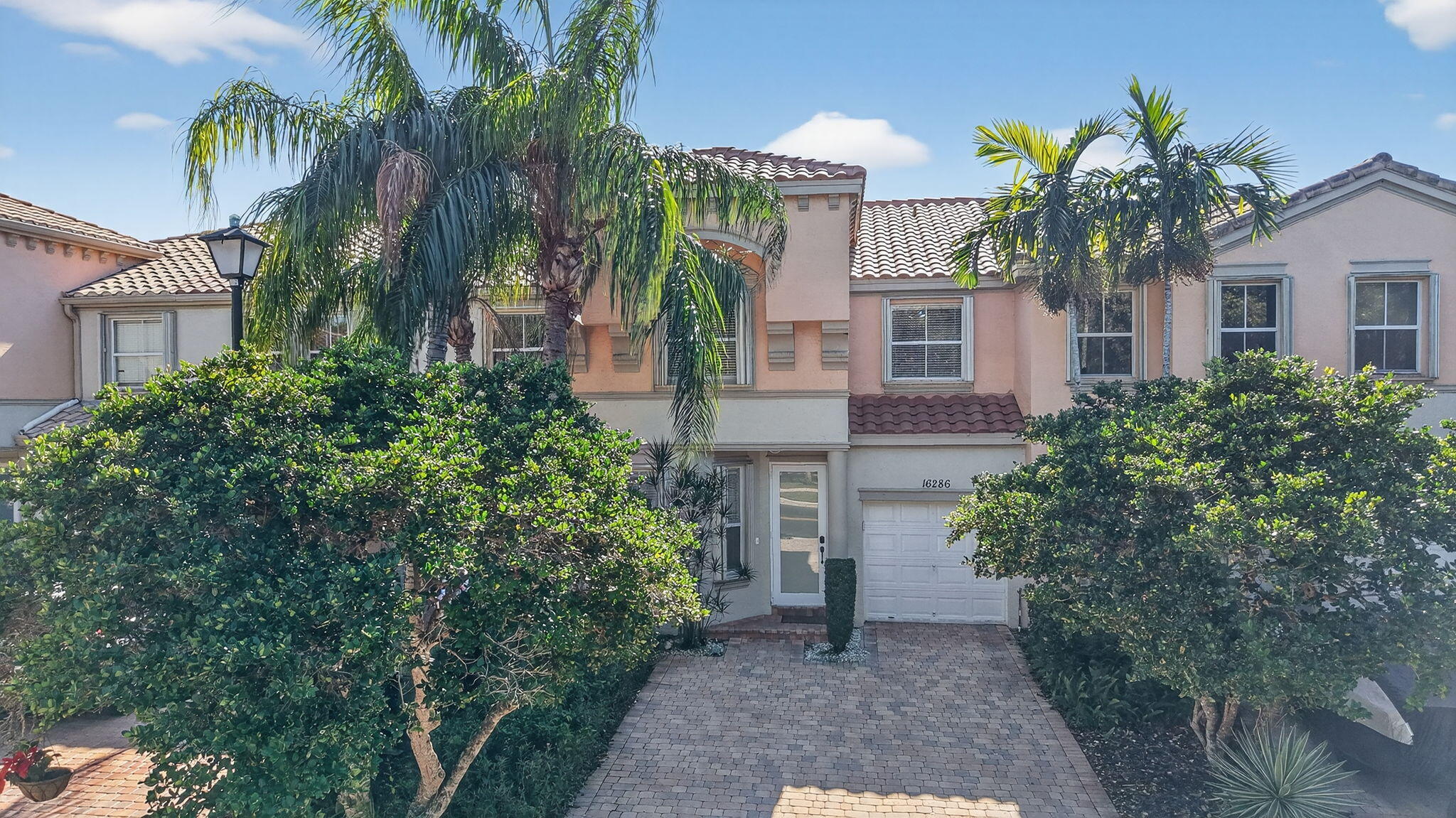 16286 Southwest 47th Manor Miramar, FL 33027 - Photo 45 of 61 a front view of a house with a yard
