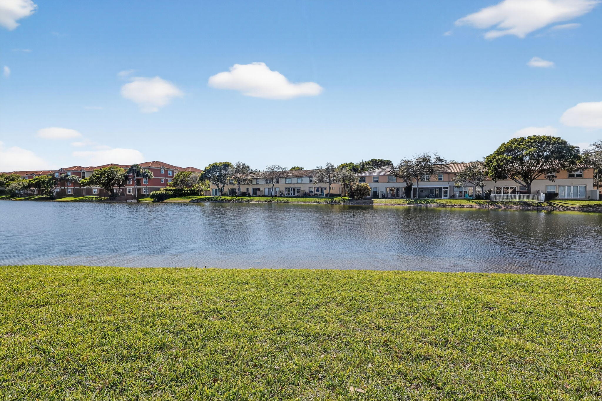 16286 Southwest 47th Manor Miramar, FL 33027 - Photo 46 of 61 a view of a lake with houses in the back