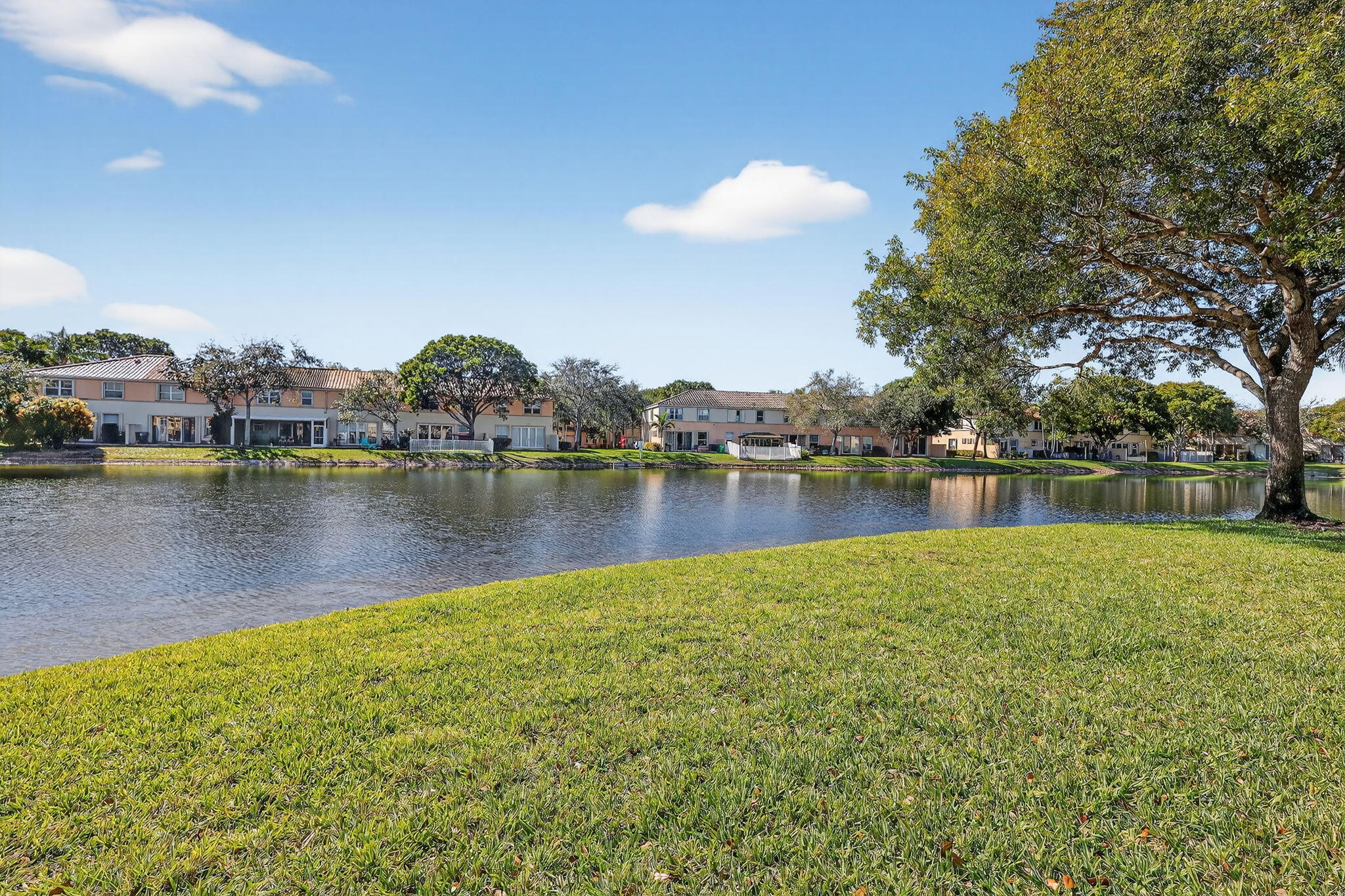 16286 Southwest 47th Manor Miramar, FL 33027 - Photo 47 of 61 a view of a lake with houses in the back