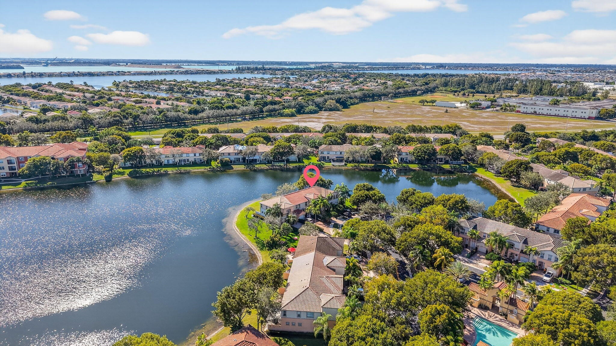 16286 Southwest 47th Manor Miramar, FL 33027 - Photo 52 of 61 an aerial view of residential houses with outdoor space and lake view