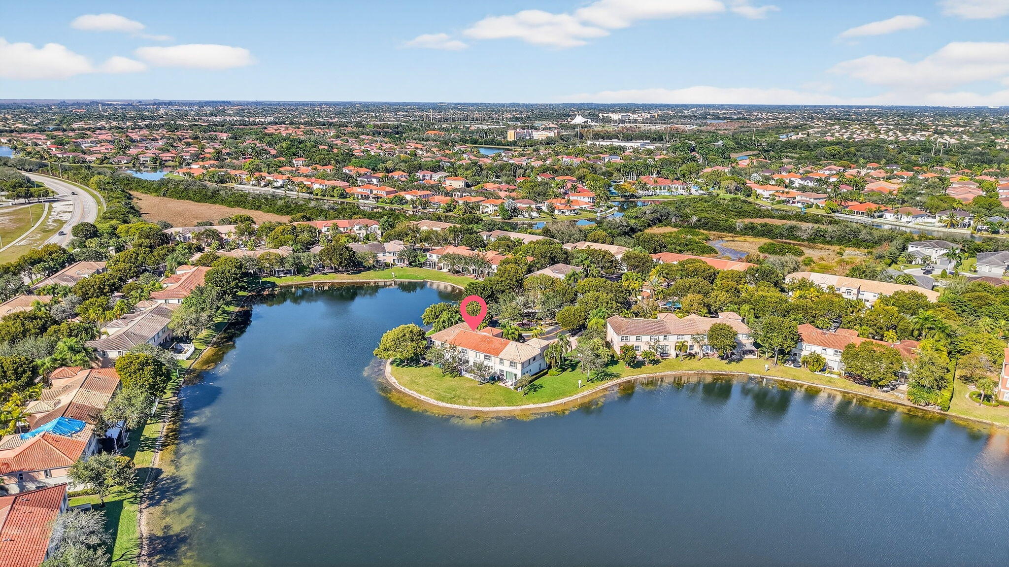 16286 Southwest 47th Manor Miramar, FL 33027 - Photo 56 of 61 an aerial view of a house with a lake view