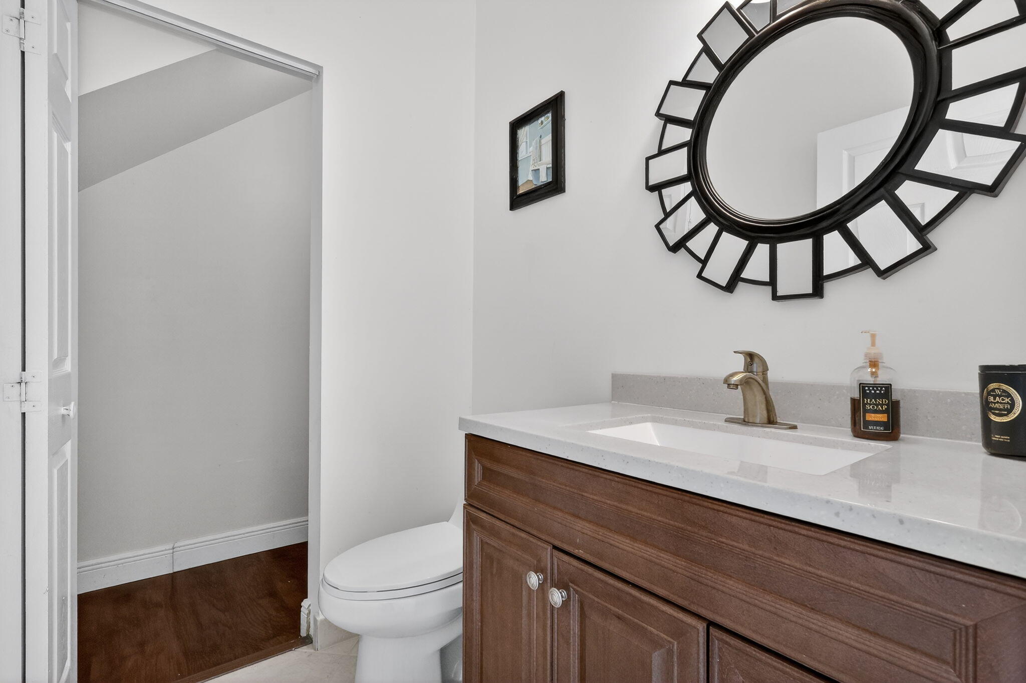 16286 Southwest 47th Manor Miramar, FL 33027 - Photo 9 of 61 a bathroom with a toilet a sink and a mirror